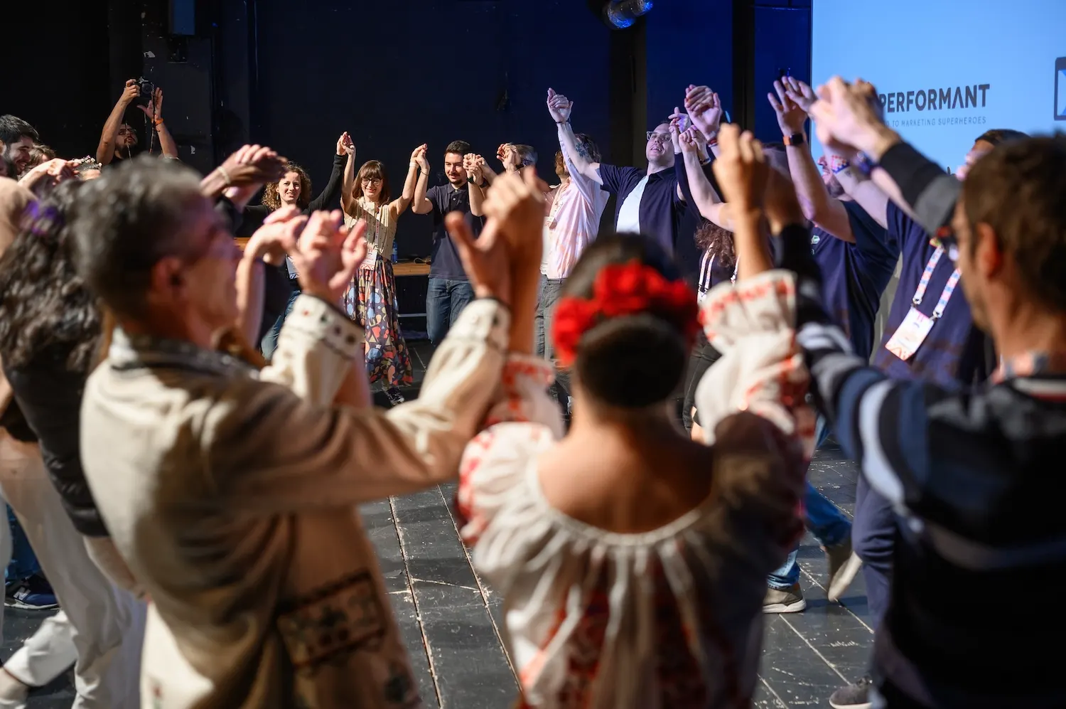 Attendees joining a traditional Romanian hora dance at Friendly.rb 2024