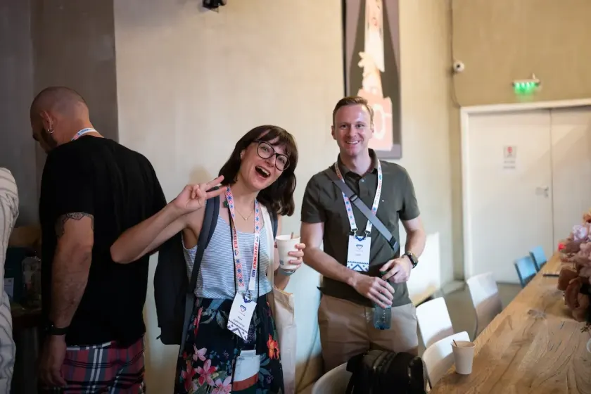 Two attendees smiling during a break at Friendly.rb Conf 2025