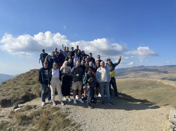 Friendly.rb attendees posing on a mountain summit on the Friday trip